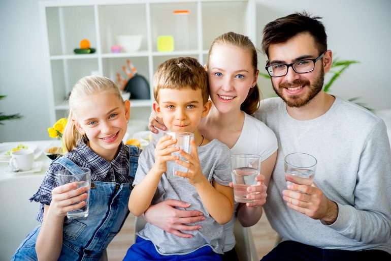 happy family drinking city water