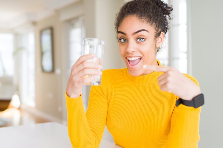 woman drinking filtered tap water