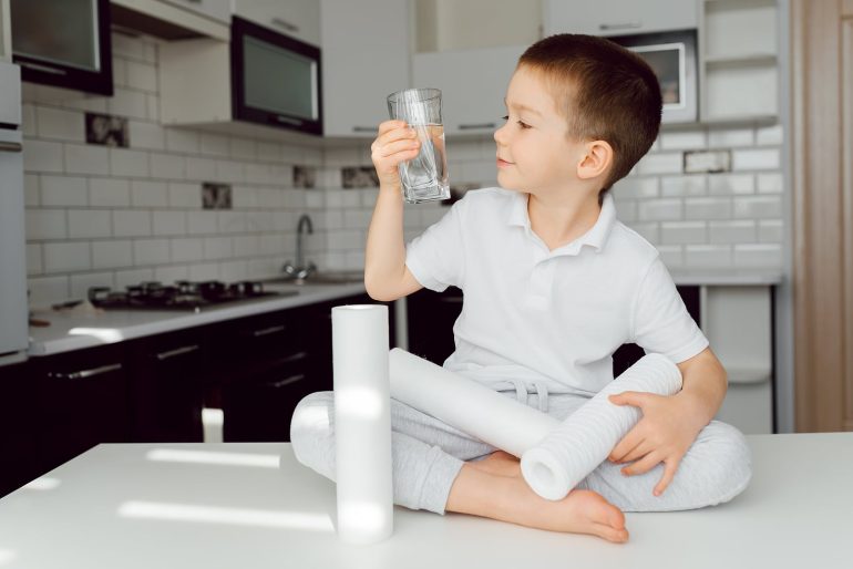 boy drinking purified water