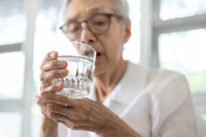 elderly lady drinking water