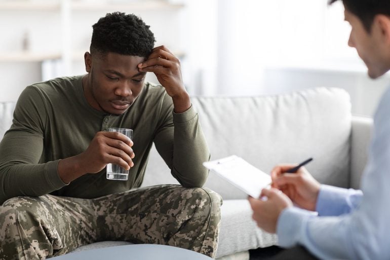 Military man drinking water