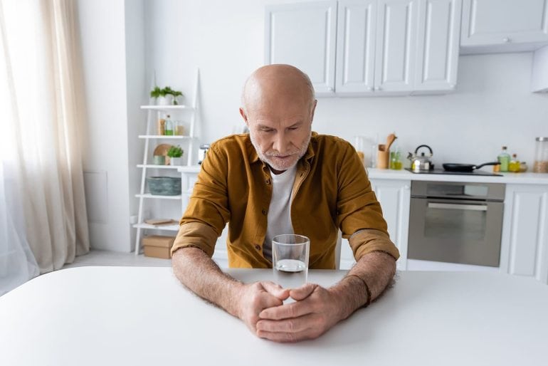 Man with glass of water