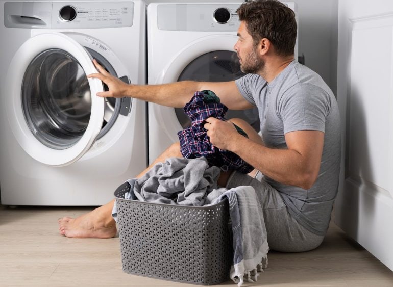 man doing laundry