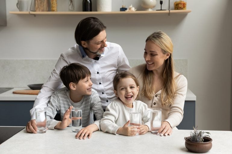 Family at kitchen island