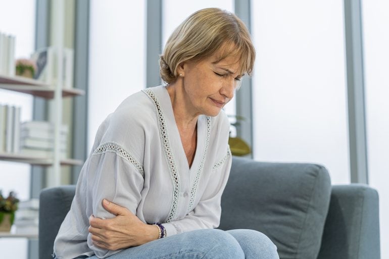 Nauseous woman on couch