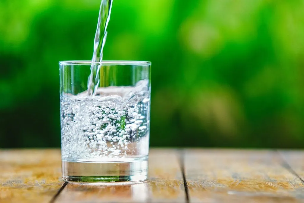 pouring glass of hydrogen water