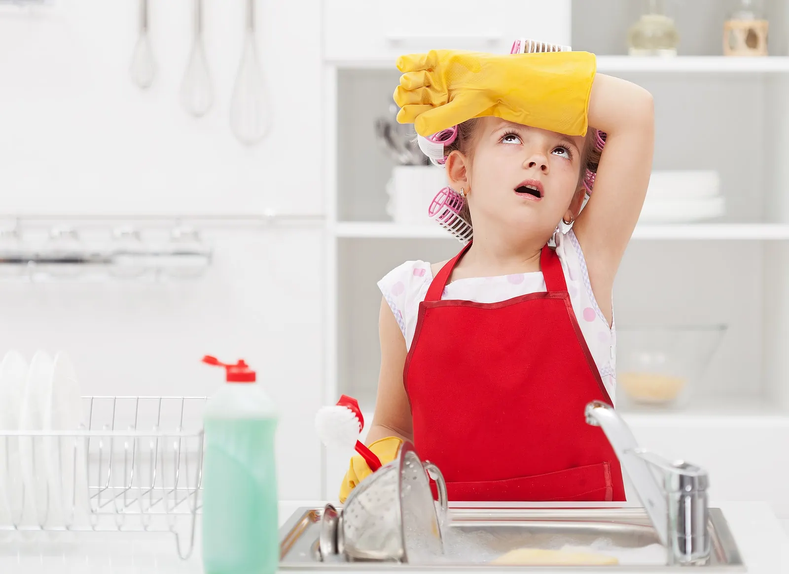 little girl cleaning kitchen